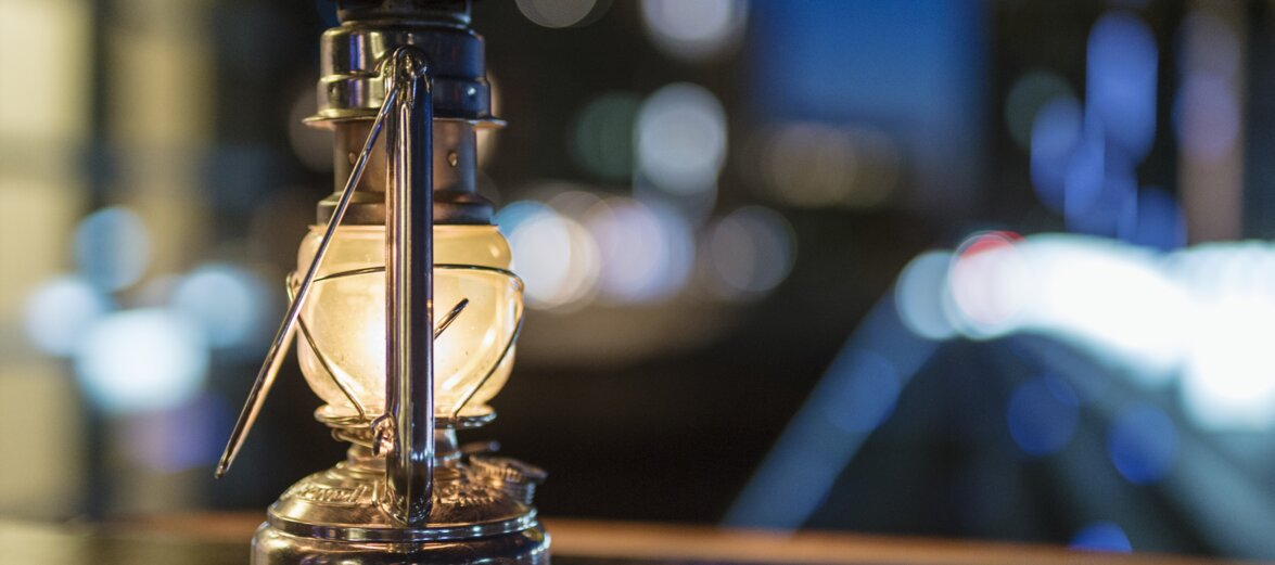 Old oil lamp on table 